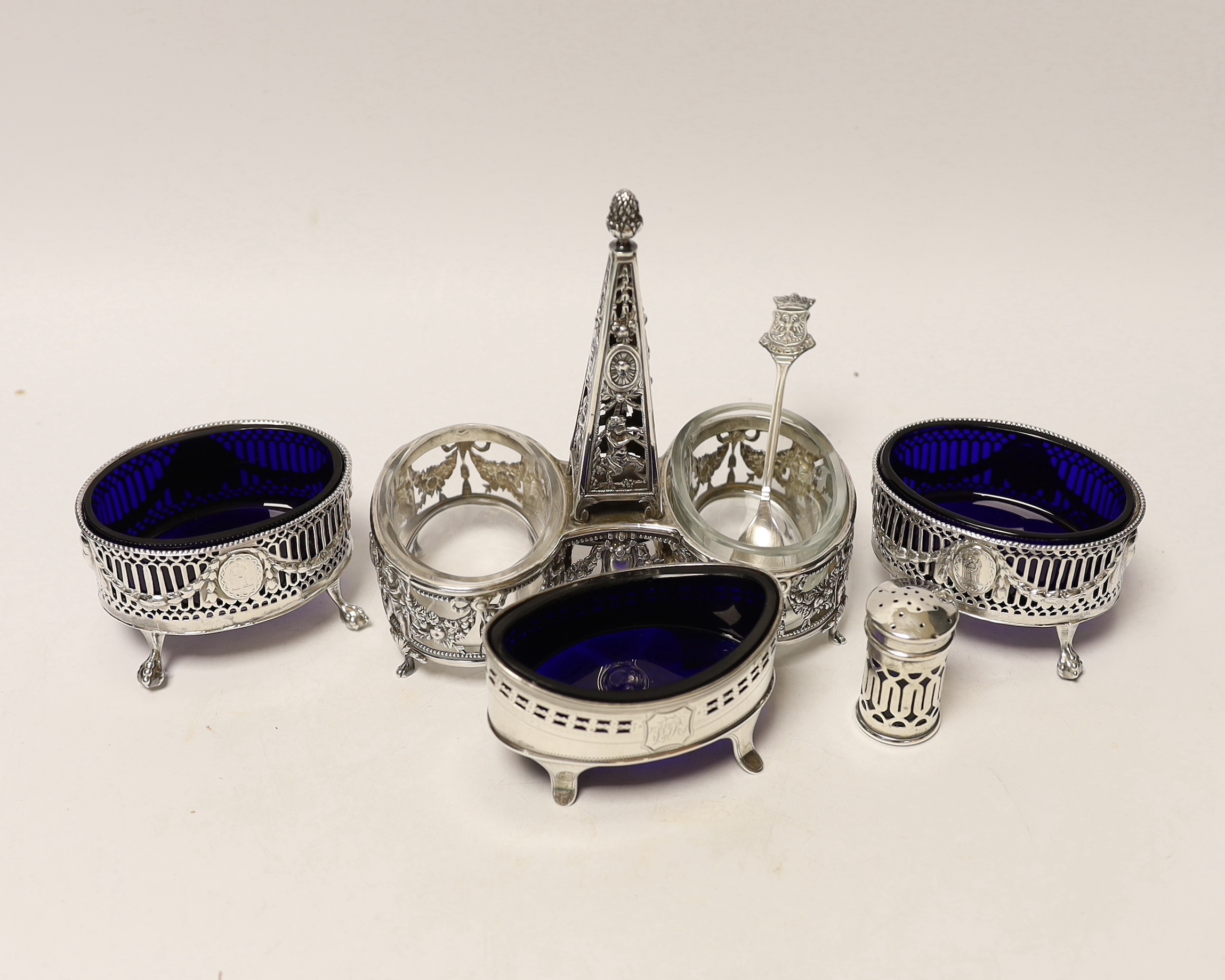 A French pierced white metal double condiment stand, height 14.6cm and four other silver condiments including pair of George III silver salts by Daniel Holy & Co.